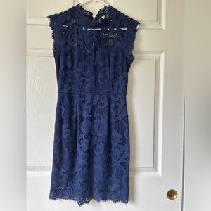 Rich dark blue mid dress, with high neckline and lace cutout fabric, Size M